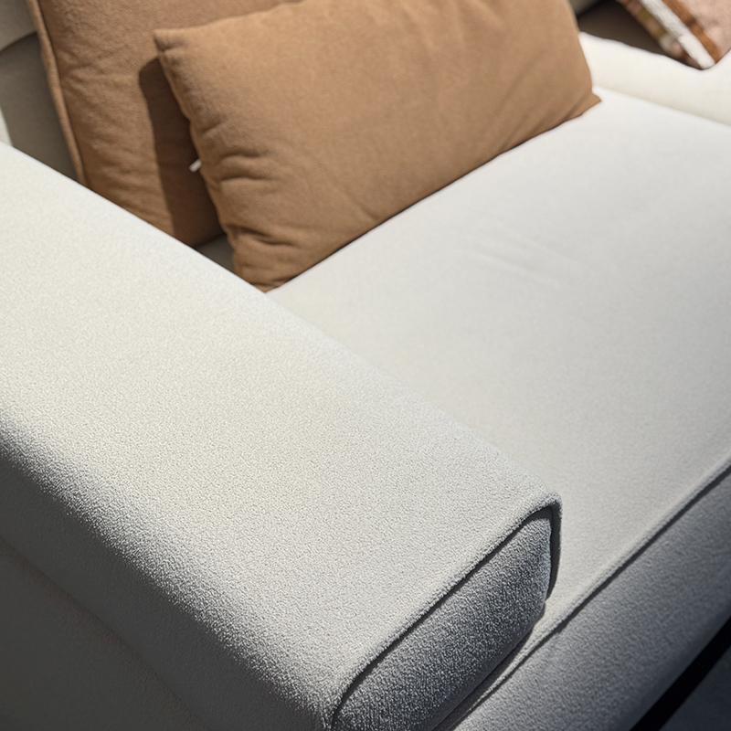 How can the color scheme of a cotton and linen three-piece sofa create a warm and inviting home atmosphere?